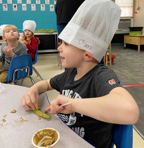 child enjoying cooking class
