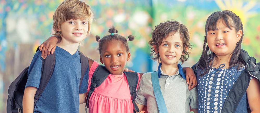 children together with backpacks