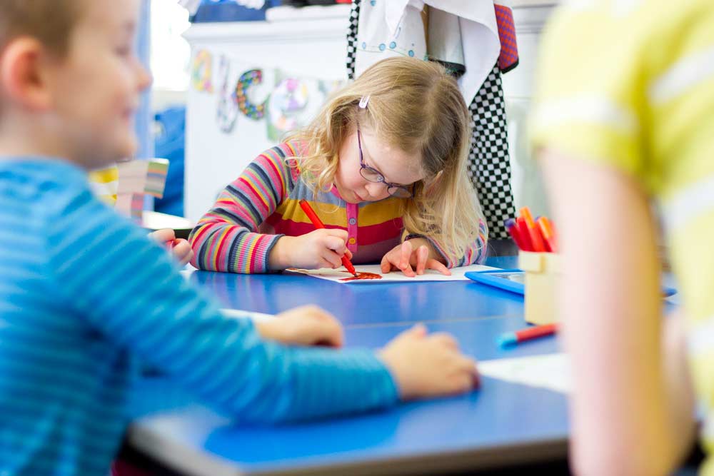 child doing artwork