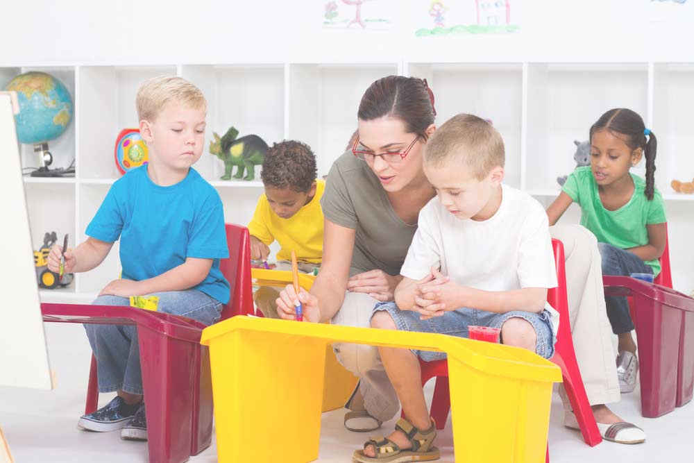 children and teacher busy in class